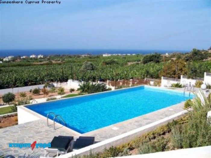 https://www.ktimatagora.com/media/property-images/63140-a-four-bedroom-luxury-villa-with-stunning-views-in-agios-georgios_full.jpg
